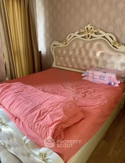 Luxurious bedroom with ornate bed frame and elegant decor, perfect for a cozy retreat.