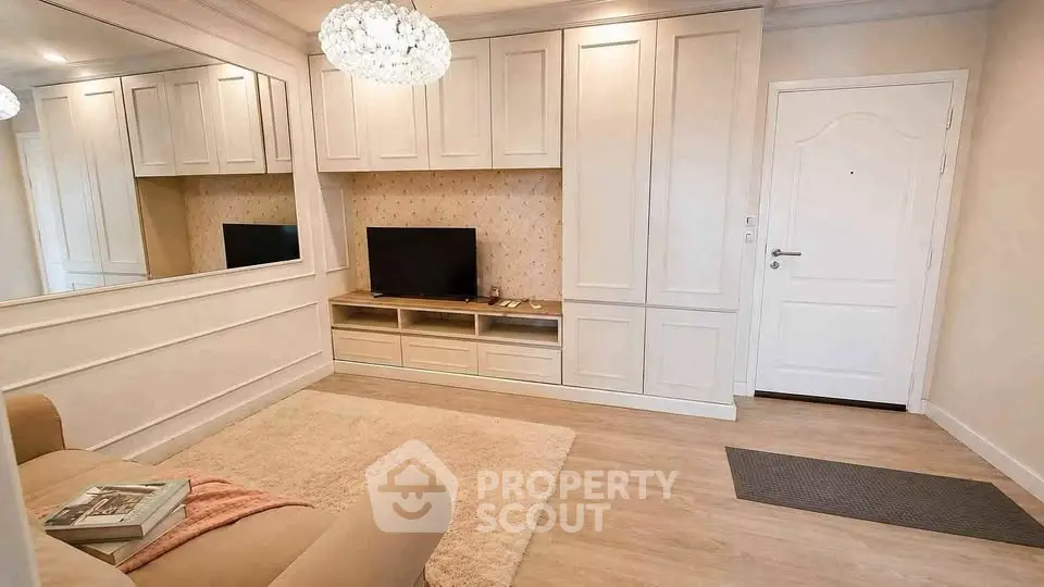 Charming living room with elegant built-in storage and cozy seating area.