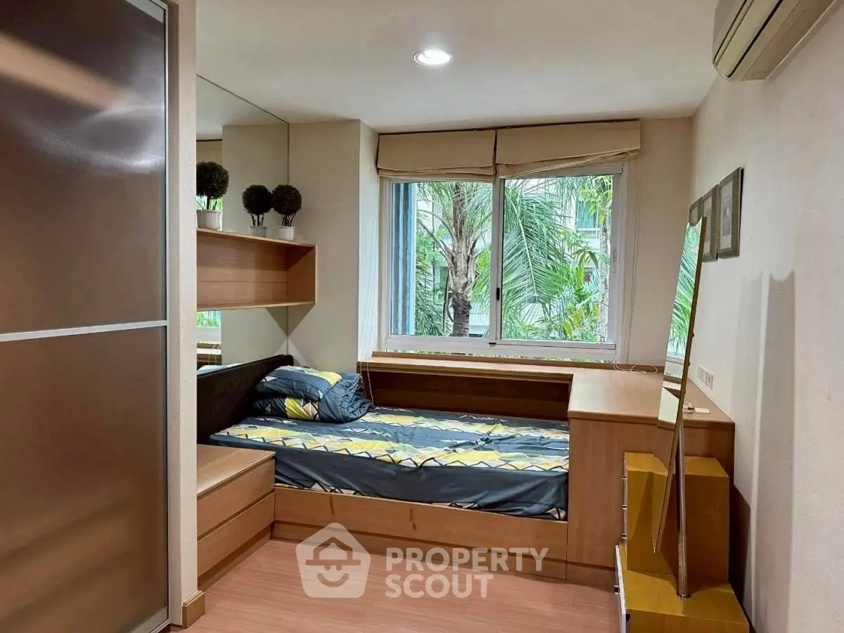 Cozy bedroom with modern decor and large window view