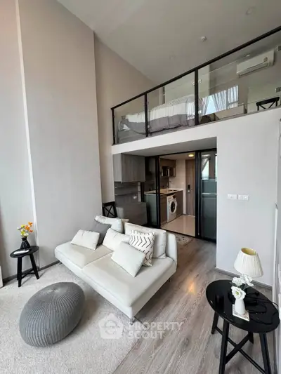 Modern loft apartment with stylish living area and mezzanine bedroom