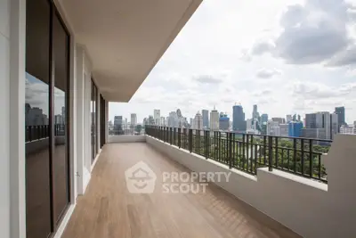 Spacious balcony with stunning city skyline view, perfect for urban living.