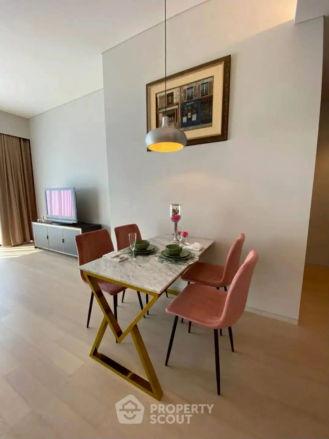 Modern dining area with stylish table and chairs in a bright apartment.