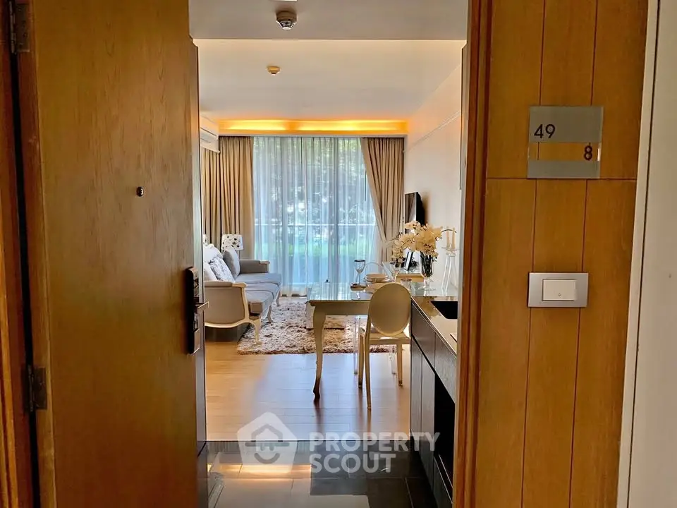 Stylish living room with modern decor and large window view, perfect for urban living.