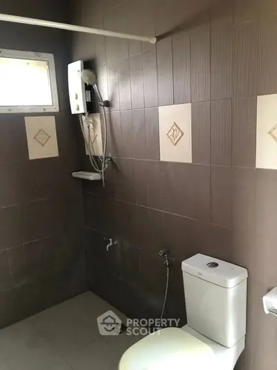 Modern bathroom with shower and toilet in minimalist design