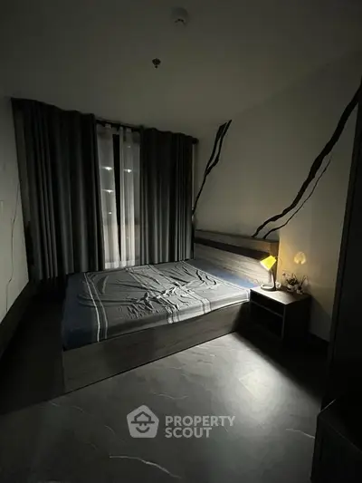 Cozy bedroom with modern decor and ambient lighting, perfect for relaxation.