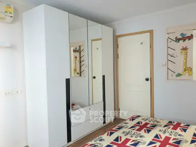 Charming bedroom with modern wardrobe and stylish decor