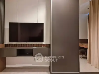 Modern living room with sleek TV setup and stylish furniture