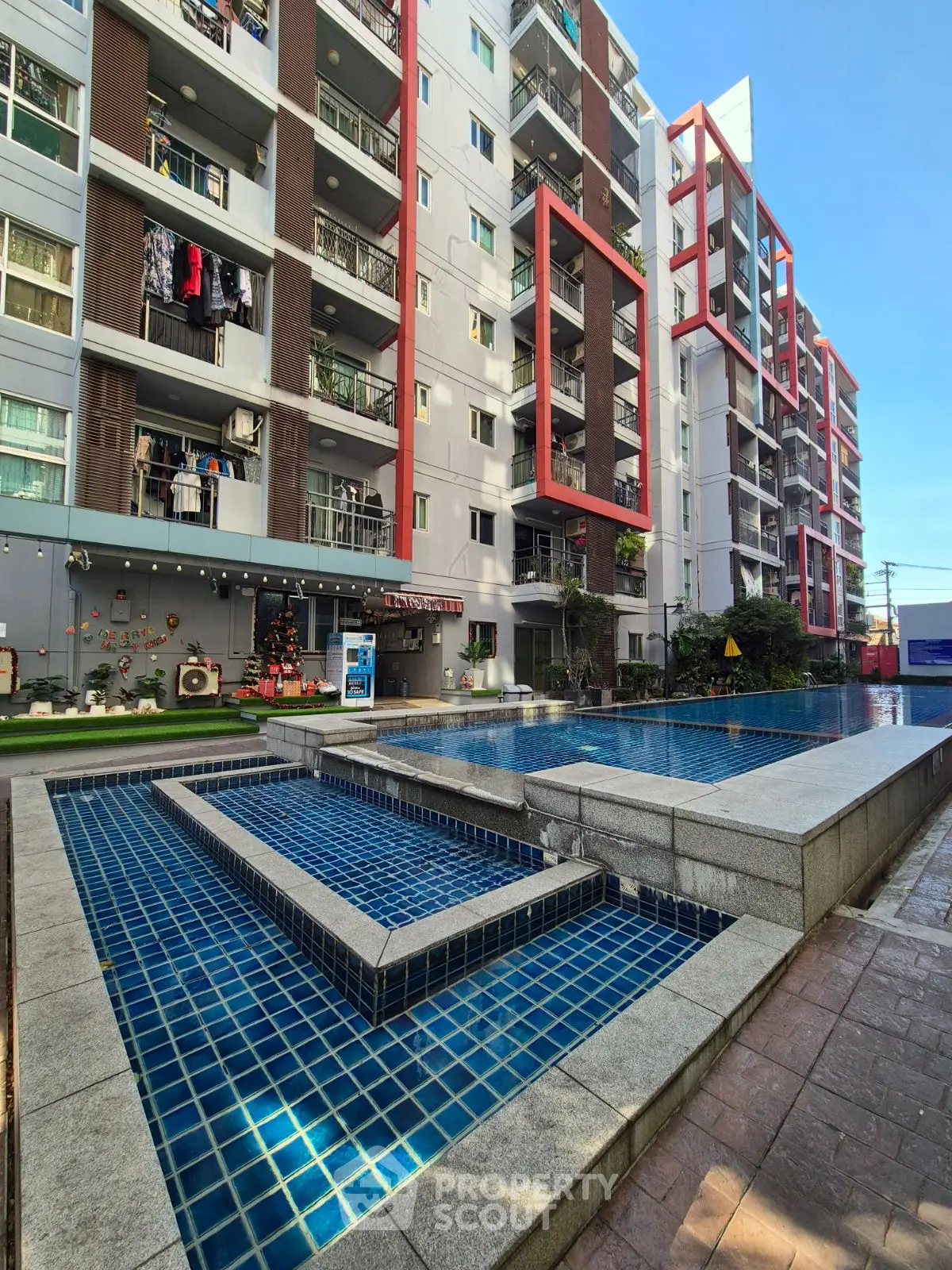 Modern apartment complex with outdoor pool and stylish architecture