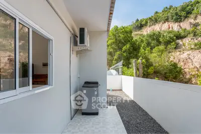 Modern balcony with scenic mountain view and air conditioning unit