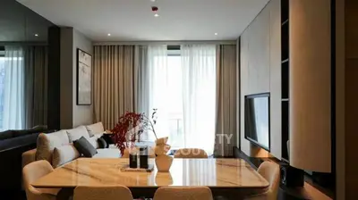 Modern living room with elegant dining area and natural light