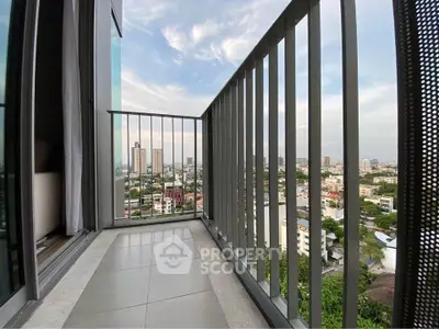 Spacious balcony with stunning city view in modern high-rise apartment.