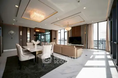 Luxurious modern living room with elegant chandeliers and panoramic city views.