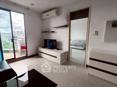 Modern living room with balcony view and sleek furniture in urban apartment