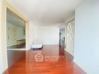 Spacious modern living room with hardwood floors and stylish partition wall