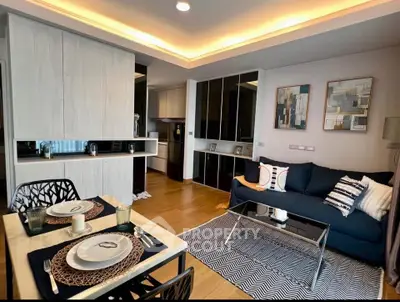 Modern living room with stylish decor and open kitchen layout