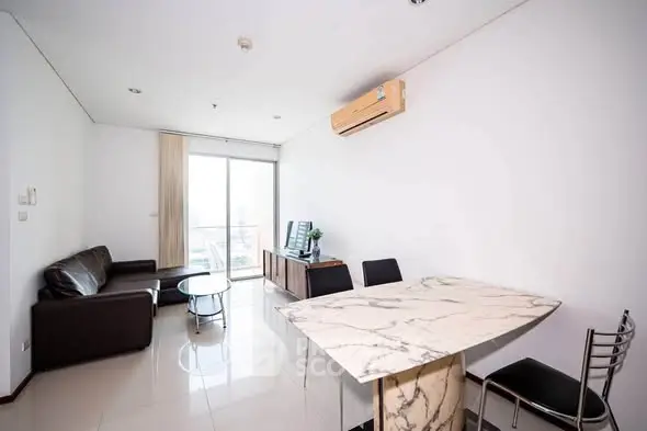 Modern living room with marble dining table and leather sofa, featuring air conditioning and natural light.
