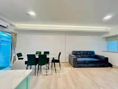 Spacious modern living room with sleek furniture and natural light