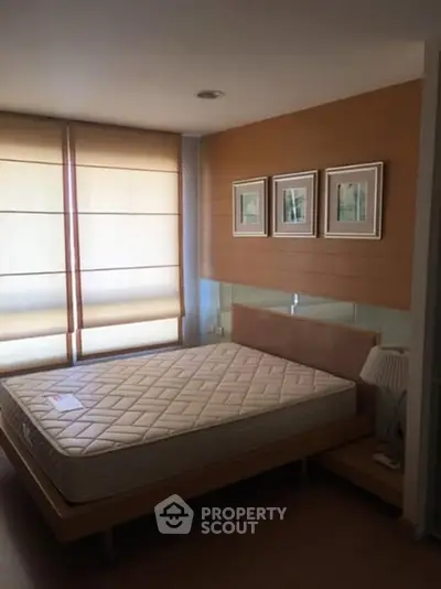 Cozy bedroom with natural light and modern decor