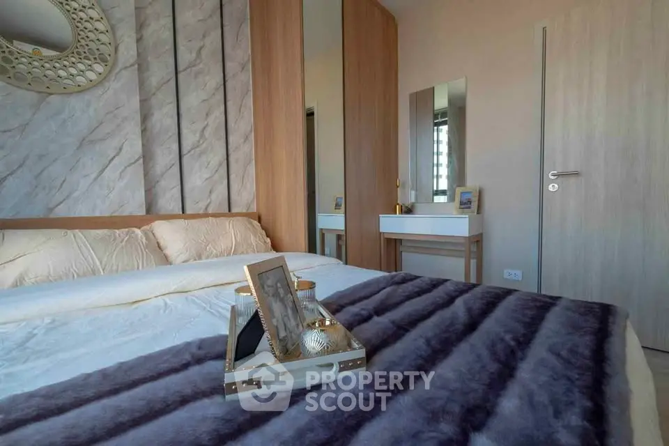 Luxurious bedroom with modern decor and plush bedding