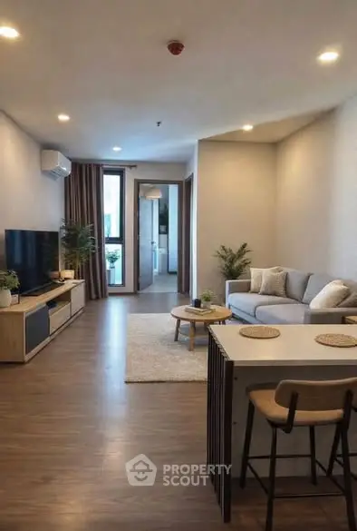 Modern living room with stylish decor and open layout, featuring cozy seating and natural light.