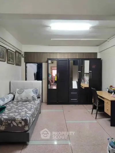 Cozy bedroom with modern furniture and ample storage space