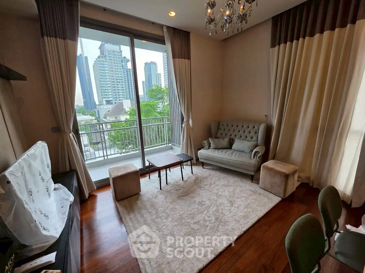 Luxurious living room with elegant decor and city view balcony in high-rise apartment