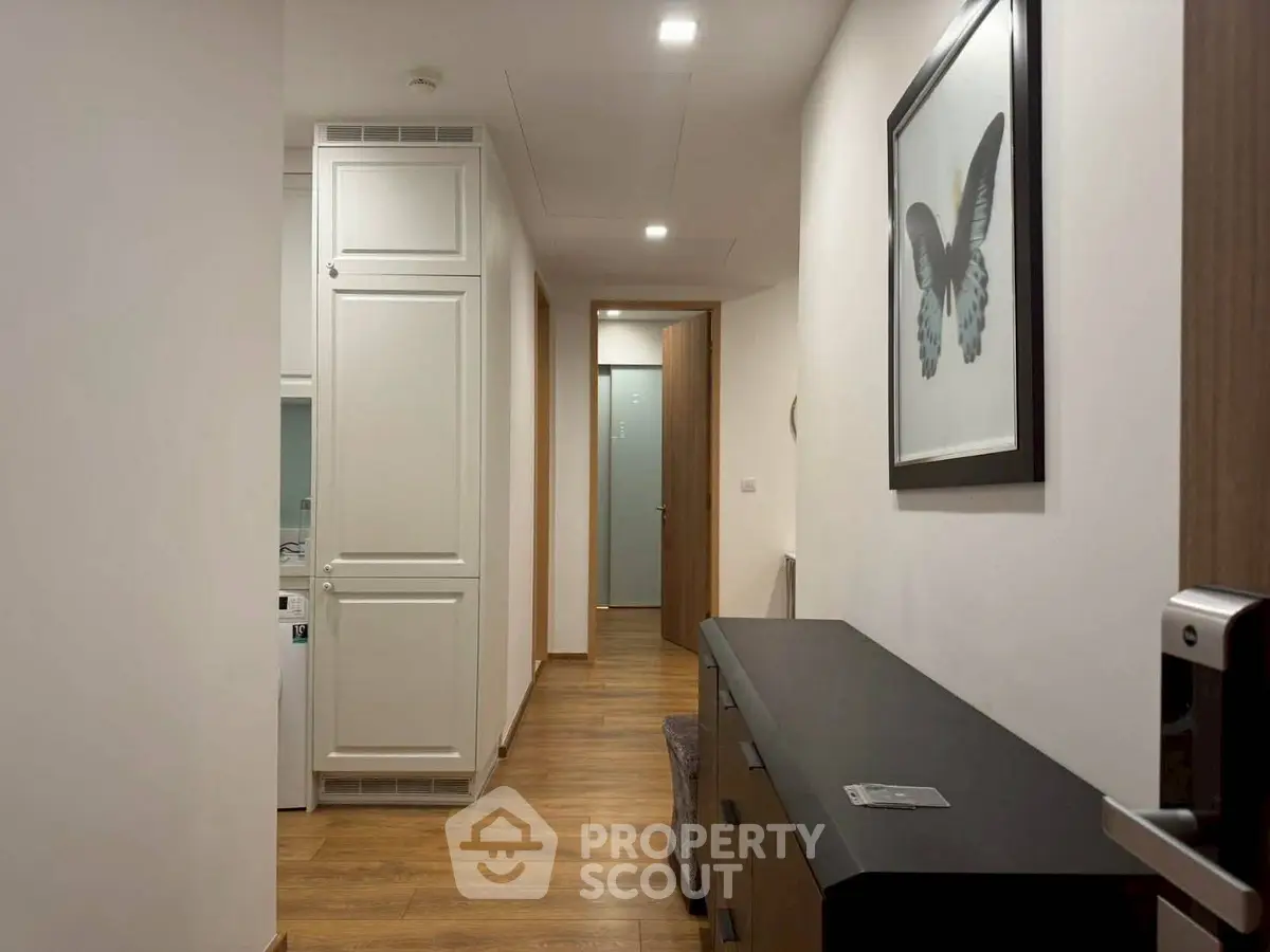 Modern hallway with wooden flooring and stylish decor