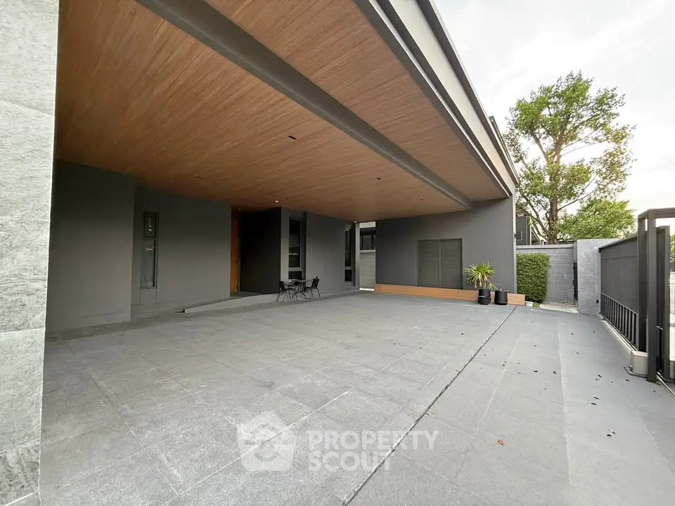 Spacious modern home entrance with sleek design and ample outdoor space.