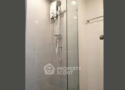 Modern bathroom with sleek shower design and glass partition