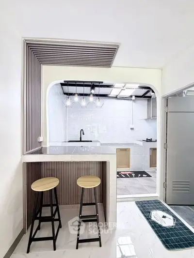 Modern kitchen with open layout and stylish breakfast bar