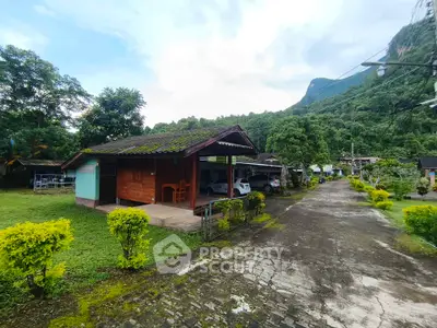 Charming countryside house with lush greenery and mountain views, perfect for nature lovers seeking tranquility.