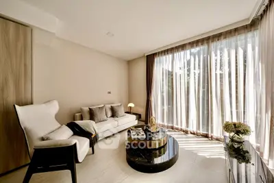 Elegant living room with floor-to-ceiling windows and modern decor