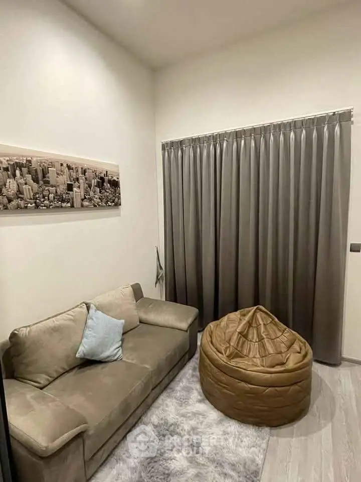 Cozy living room with plush sofa and stylish decor in modern apartment.