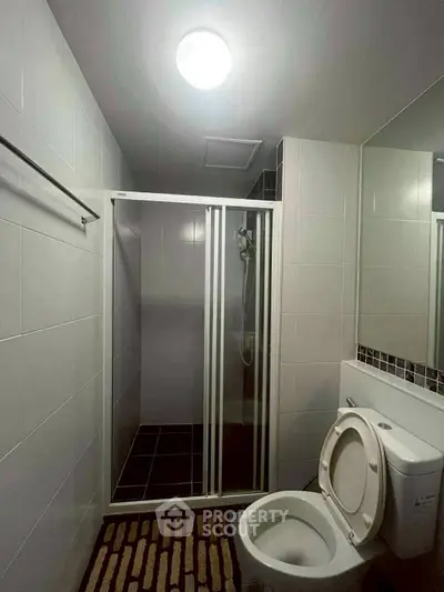 Modern bathroom with shower and toilet in sleek design