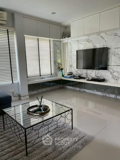 Modern living room with sleek TV setup and stylish decor