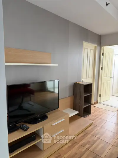 Modern living room with sleek TV stand and wooden flooring