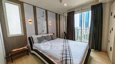 Modern bedroom with stylish decor and city view from large window