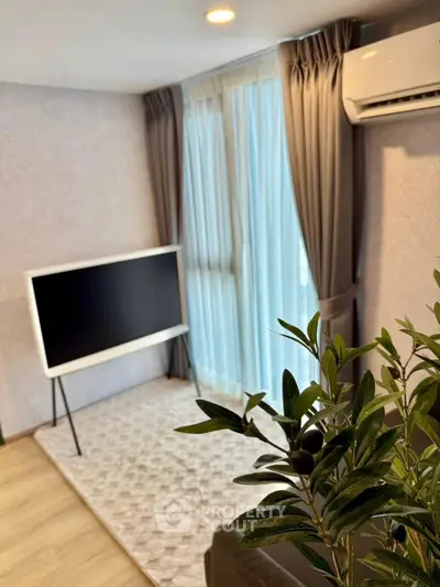 Modern living room with stylish TV setup and elegant curtains