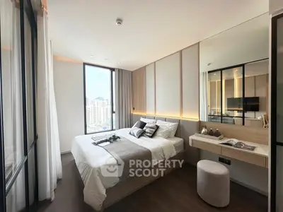 Luxurious modern bedroom with city view, elegant decor, and ample natural light.