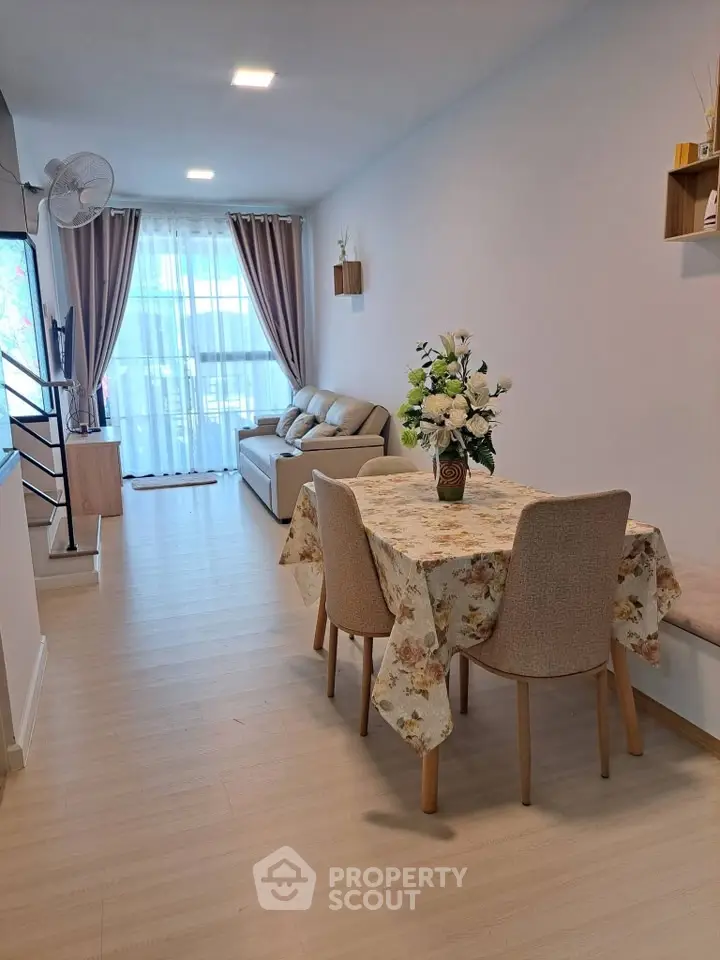 Charming living room with elegant decor, cozy seating, and natural light, perfect for relaxation and entertaining.
