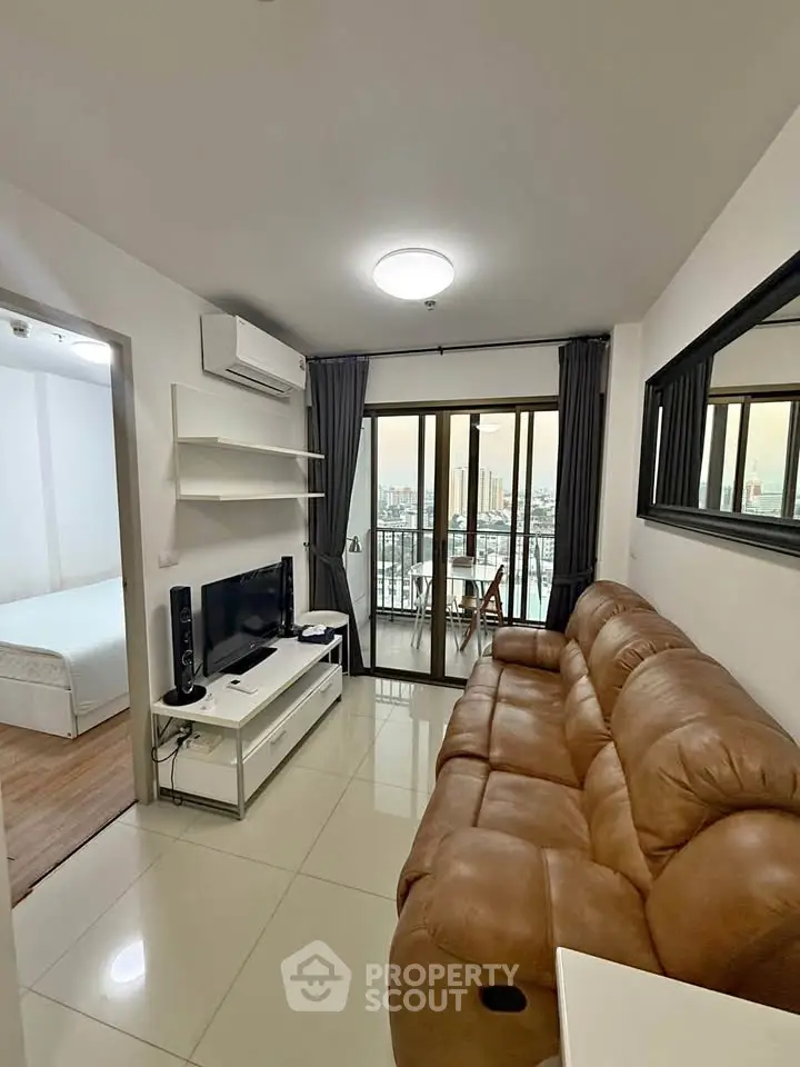 Modern living room with leather sofa and city view balcony