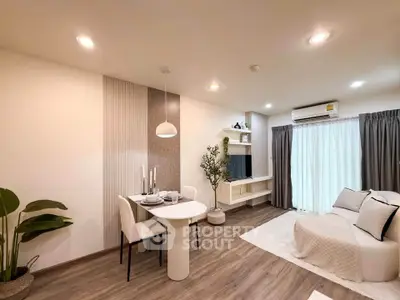 Modern living room with elegant decor, featuring a cozy seating area, stylish dining set, and ambient lighting.