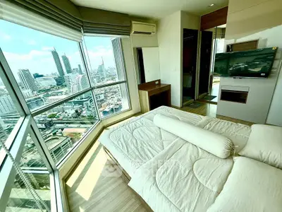 Luxurious bedroom with panoramic city view in modern high-rise apartment