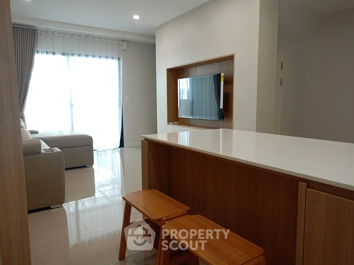 Modern living room with sleek furniture and natural light