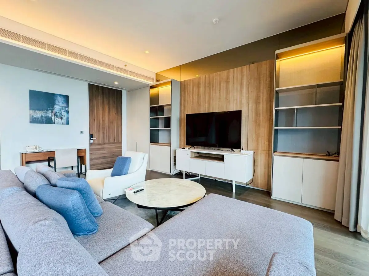 Luxurious modern living room with stylish furniture and large TV setup