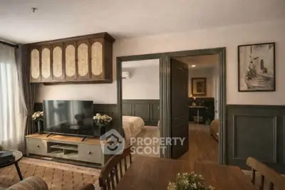 Charming living room with elegant decor and view into cozy bedrooms, perfect for modern living.