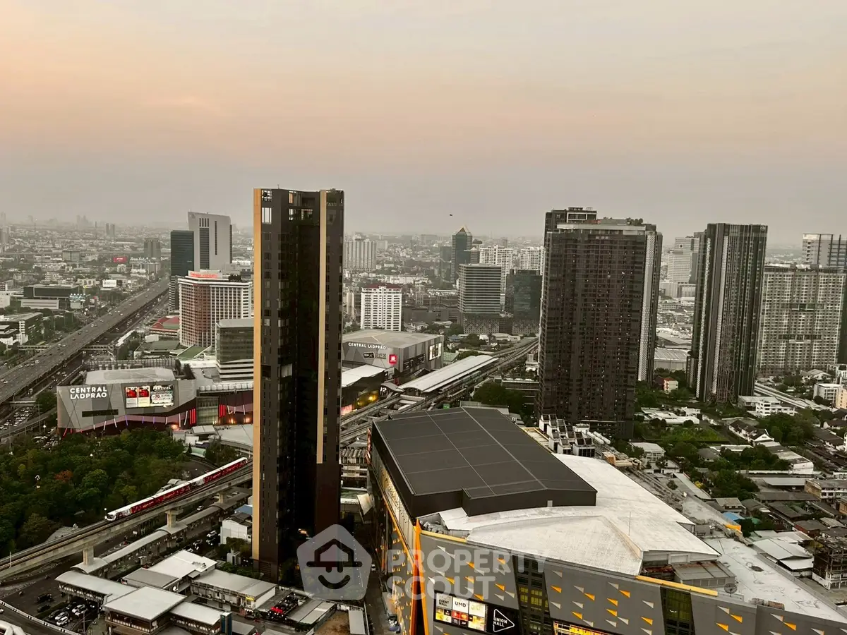 Stunning cityscape view showcasing modern skyscrapers and urban landscape at sunset.