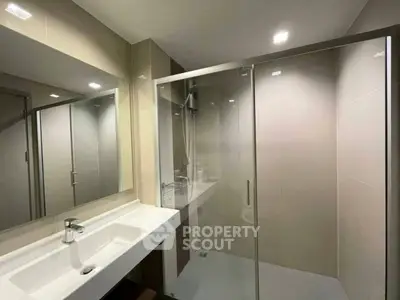 Modern bathroom with sleek shower and elegant sink design