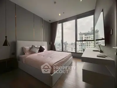 Luxurious bedroom with stunning city view and modern decor