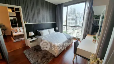 Modern bedroom with city view, stylish decor, and natural light.